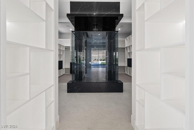 hall with concrete floors