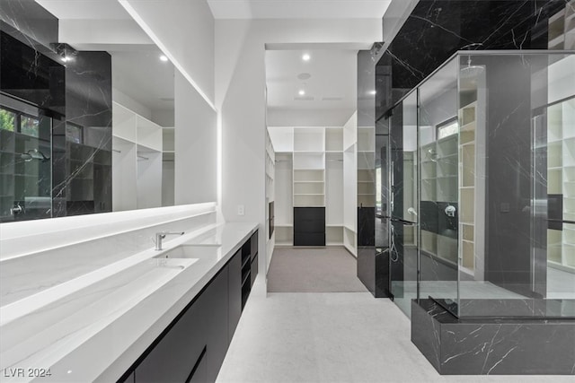 bathroom with vanity and walk in shower