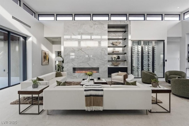 1 Olympia Canyon Way, Las Vegas, NV 89141 - living room with a high ceiling and a premium fireplace
