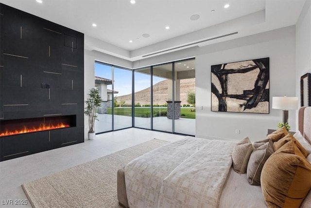 1 Olympia Canyon Way, Las Vegas, NV 89141 - tiled bedroom with access to exterior, a fireplace, recessed lighting, and a mountain view