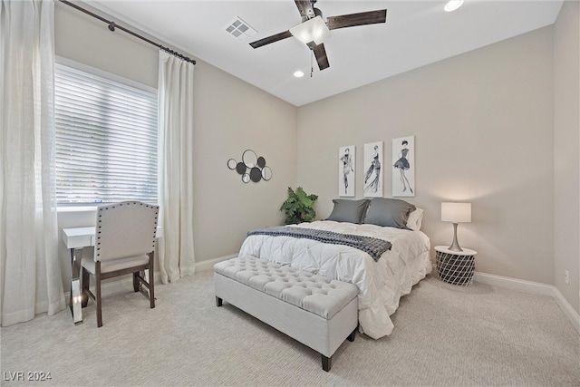 bedroom featuring light colored carpet and ceiling fan