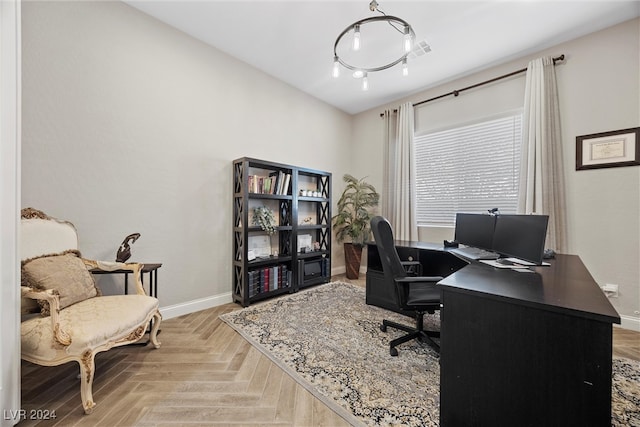 office space with light parquet floors and a notable chandelier