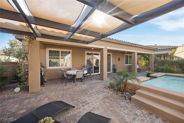 view of patio / terrace featuring a fenced in pool