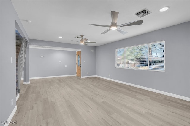 unfurnished room featuring light hardwood / wood-style floors and ceiling fan