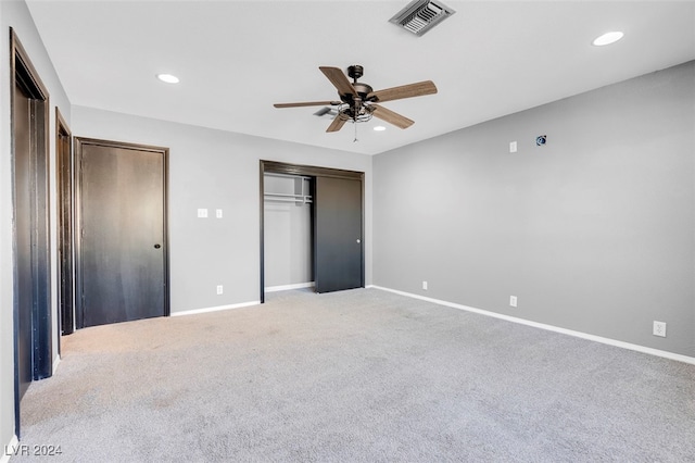 unfurnished bedroom with ceiling fan and carpet flooring