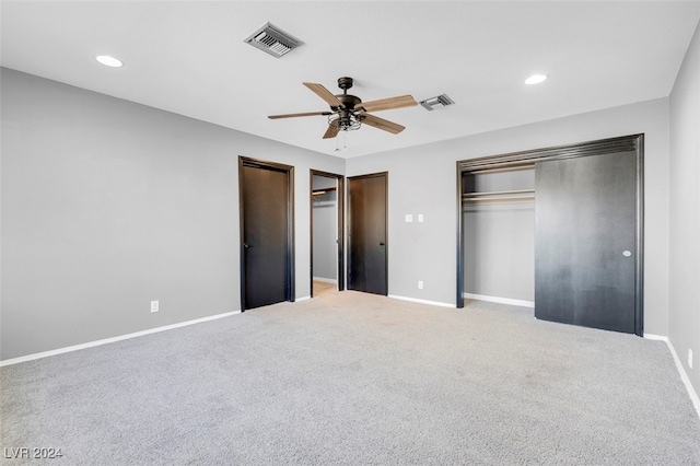 unfurnished bedroom with ceiling fan and carpet