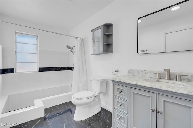 full bathroom featuring shower / bath combo with shower curtain, vanity, and toilet