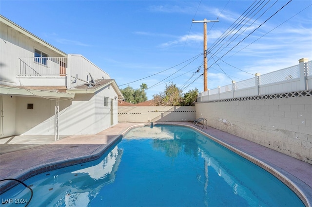 view of swimming pool with a patio area