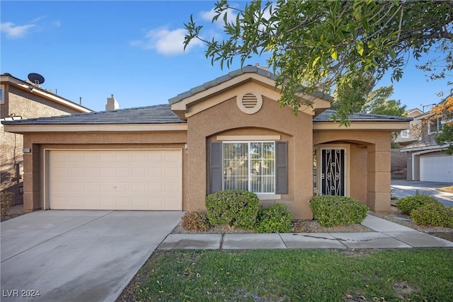 view of front of property with a garage