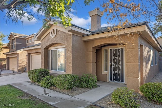 view of front of home with a garage