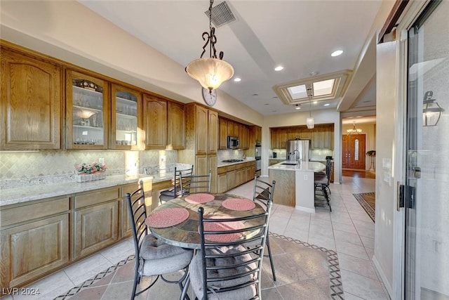 dining area featuring light tile patterned floors, baseboards, visible vents, and recessed lighting