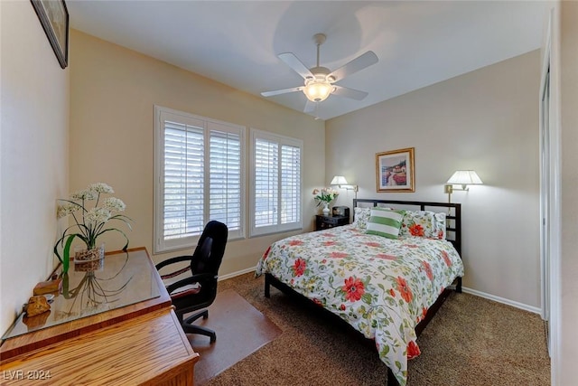 bedroom with ceiling fan, baseboards, and carpet flooring