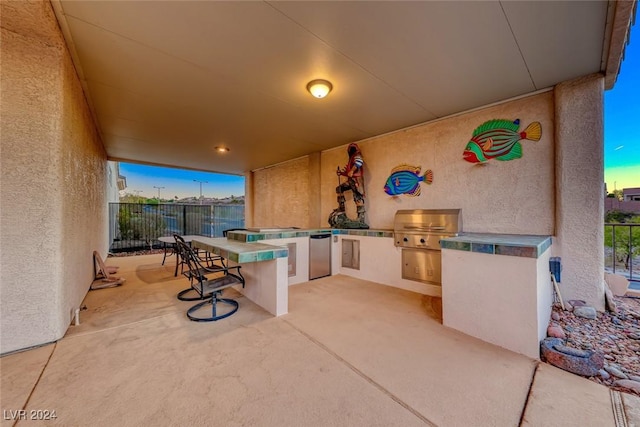 view of patio / terrace with fence and area for grilling