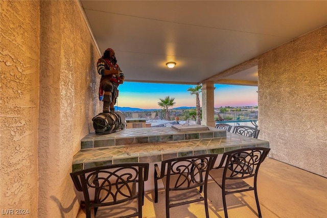 patio terrace at dusk with exterior bar