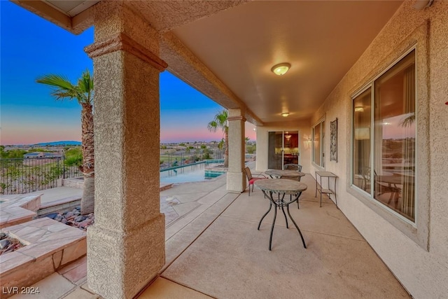 view of patio featuring fence and a fenced in pool