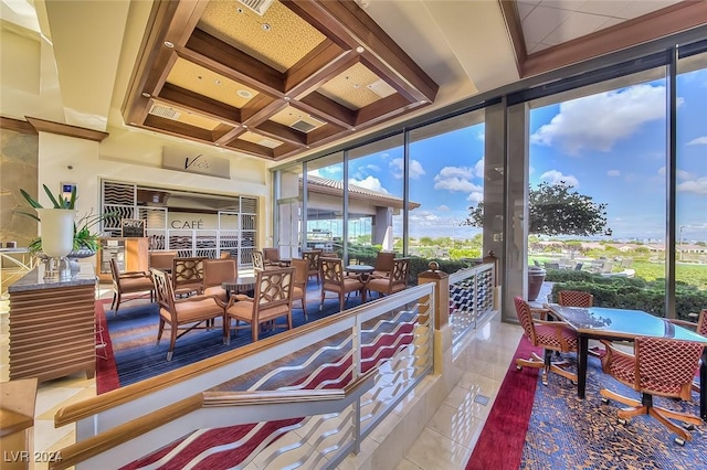 interior space with beamed ceiling and coffered ceiling