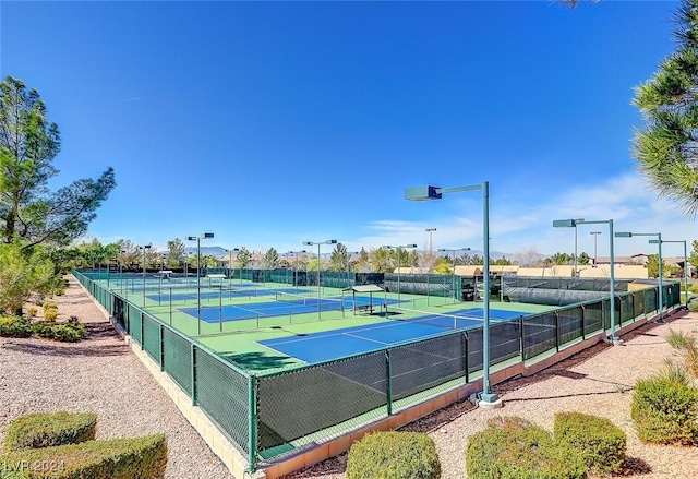 view of sport court featuring fence