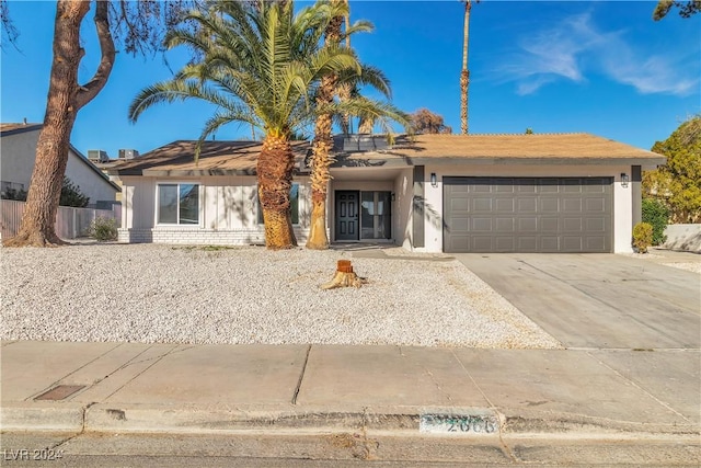 single story home with a garage