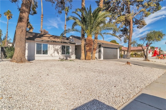 single story home featuring a garage