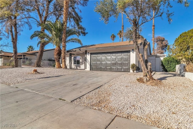 ranch-style home featuring a garage