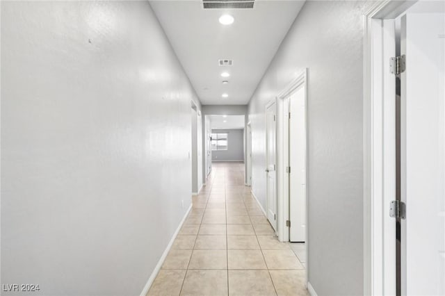 hallway featuring light tile patterned floors