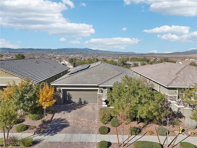 drone / aerial view featuring a mountain view