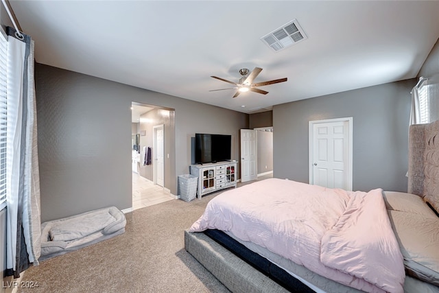 bedroom featuring light colored carpet and ceiling fan