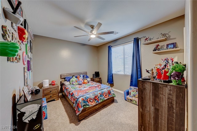 bedroom with ceiling fan and carpet floors