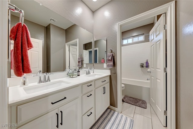 full bathroom with washtub / shower combination, vanity, and toilet