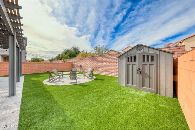 view of yard with a patio and a storage unit