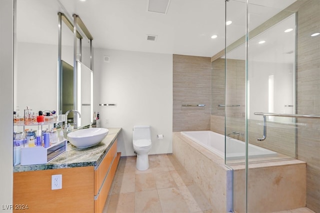 full bathroom with vanity, tile patterned flooring, shower with separate bathtub, and toilet