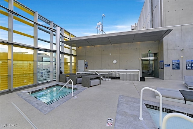 view of pool featuring an outdoor hangout area, a community hot tub, and a patio area