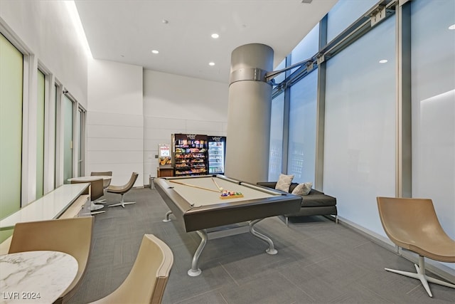 game room with pool table, carpet floors, and a high ceiling