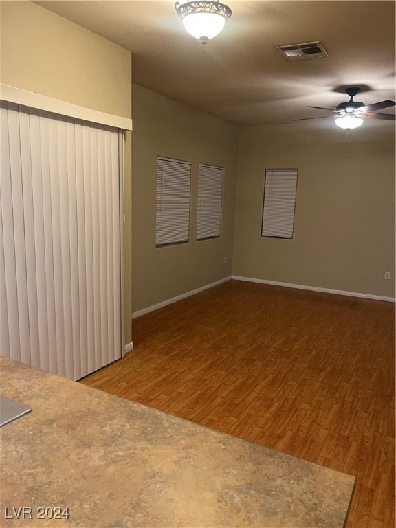 spare room featuring hardwood / wood-style floors and ceiling fan