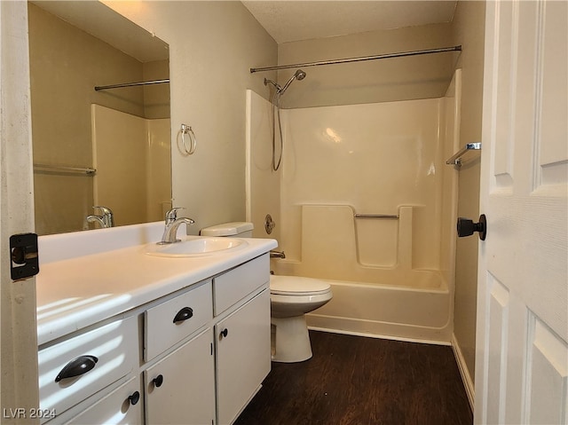 full bathroom featuring toilet, shower / bathing tub combination, vanity, and hardwood / wood-style flooring