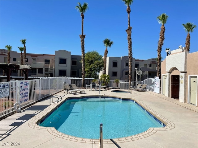 view of swimming pool featuring a patio