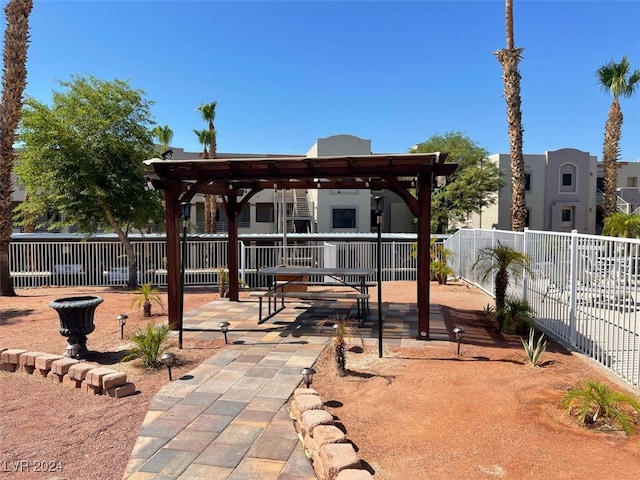 rear view of house with a pergola