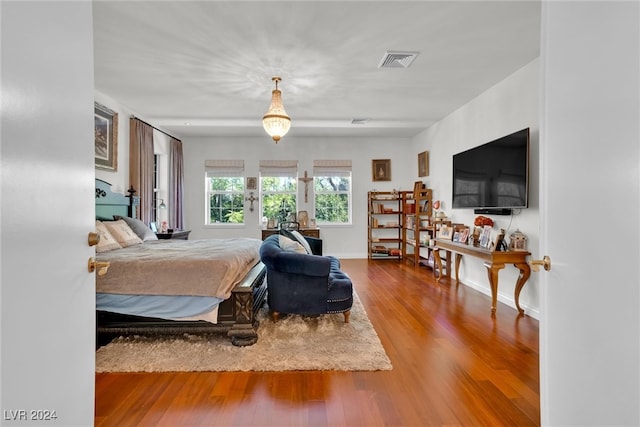 bedroom with wood-type flooring