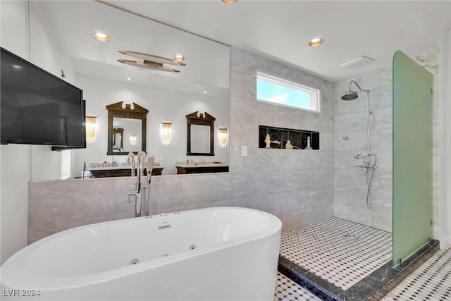 bathroom with tile patterned flooring, a tiled fireplace, vanity, and independent shower and bath