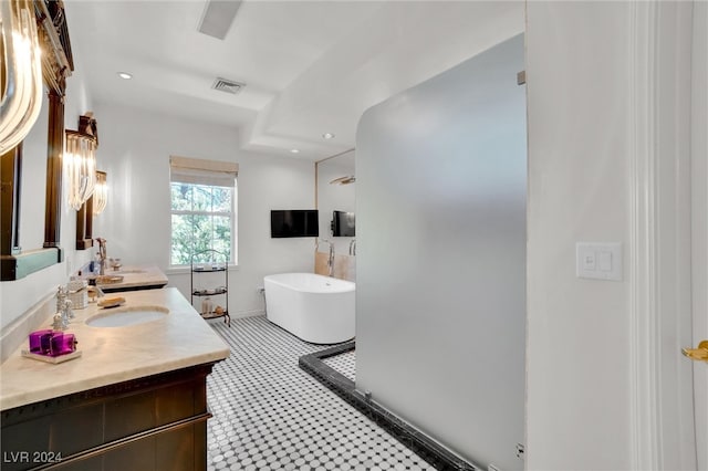 bathroom with vanity and a bathing tub