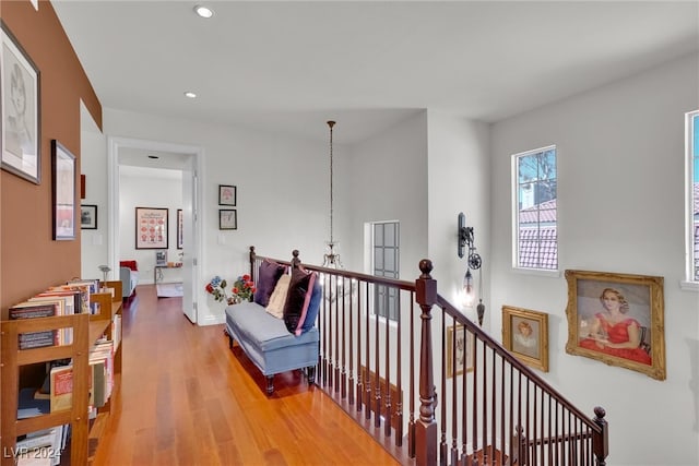 corridor with hardwood / wood-style floors