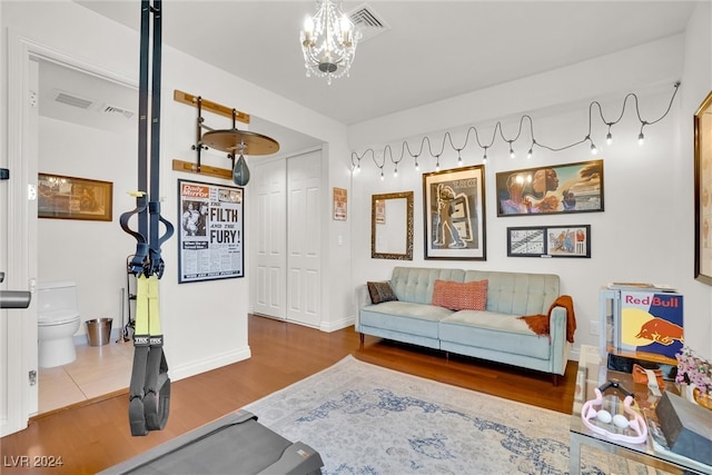 interior space with hardwood / wood-style flooring and an inviting chandelier