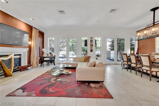 living room with light tile patterned flooring and french doors