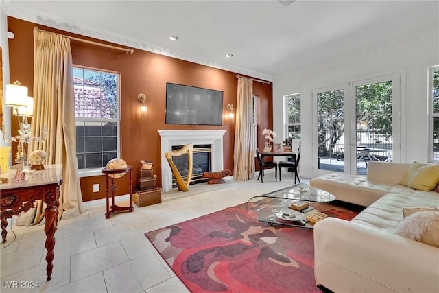 tiled living room featuring french doors and a healthy amount of sunlight