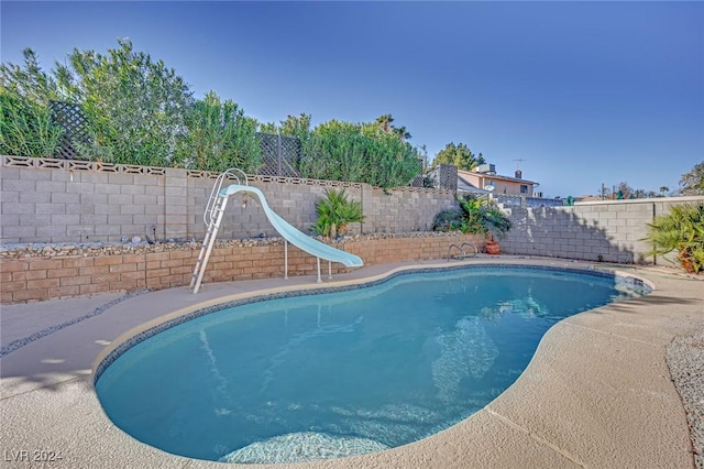 view of pool featuring a water slide