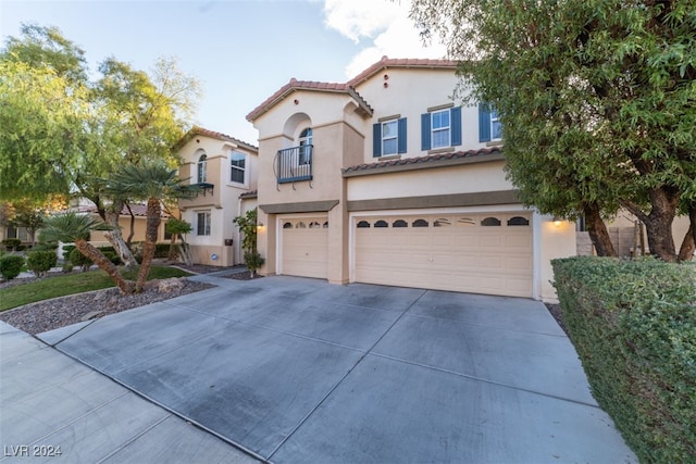 mediterranean / spanish-style home featuring a garage