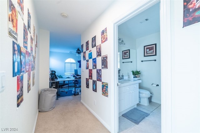 hallway with light colored carpet