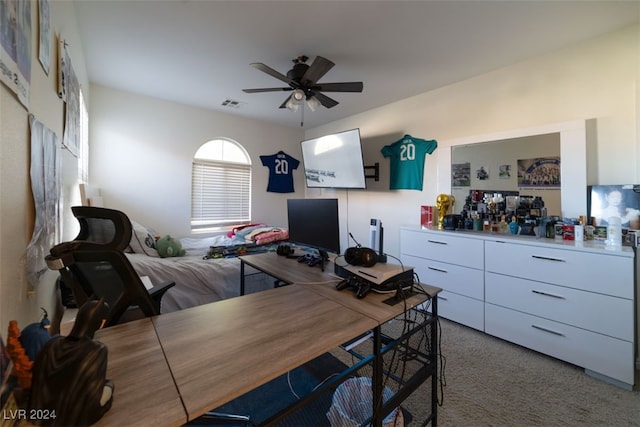 home office featuring ceiling fan and carpet