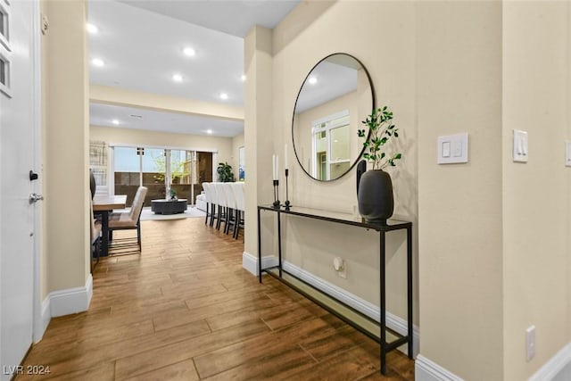 entrance foyer with recessed lighting, baseboards, and wood finished floors