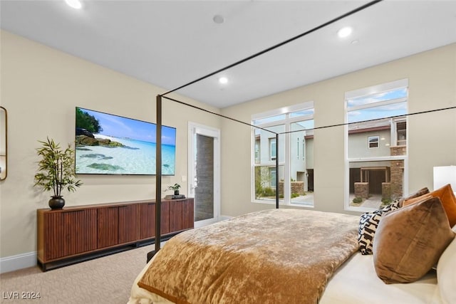 carpeted bedroom with recessed lighting